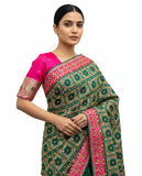 Elegant Green Silk Saree with Pink Contrast Border and Traditional Woven Design