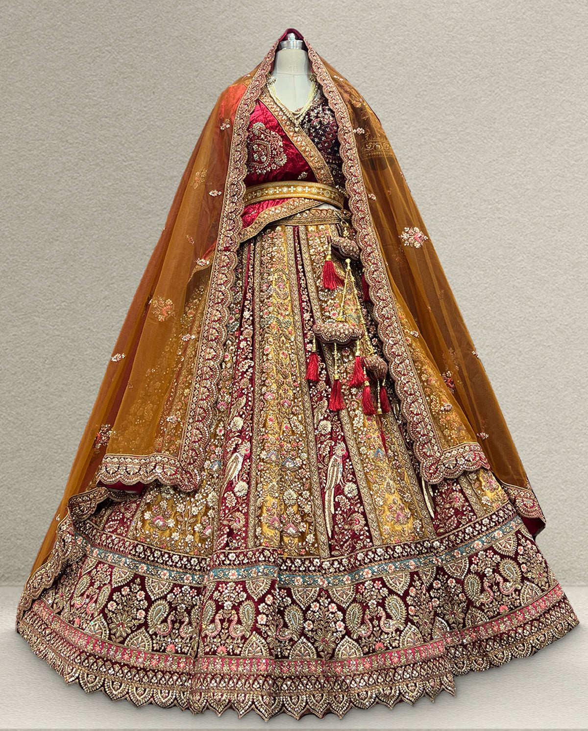 Maroon and Gold Bridal Lehenga with Heavy Zardozi Embroidery and Net Dupatta