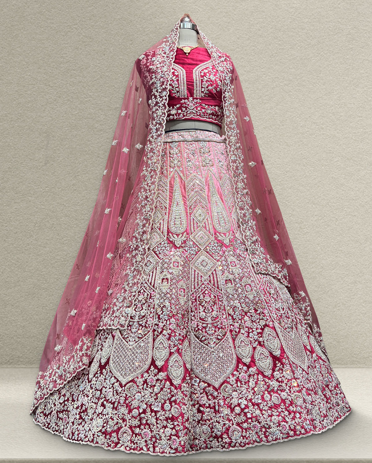 Heritage Pink Wedding Lehenga – Intricate Silver Threadwork with Layered Floral Motifs
