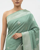 Elegant Pastel Green Silk Saree with Subtle Zari Motifs and Rich Woven Border